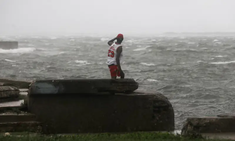 A man watches the waves, as Hurricane Melissa approaches, in Kingston, Jamaica, on October 28. — Reuters