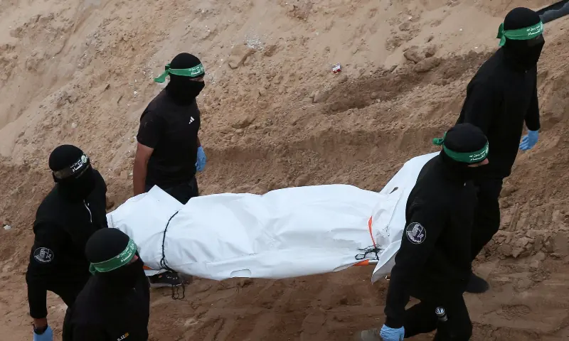  Hamas members carry a dead body during a search for deceased hostages seized by Hamas during the Oct 7, 2023 attack on Israel, in Khan Younis, southern Gaza Strip, on Oct 28, 2025. &mdash; Reuters 