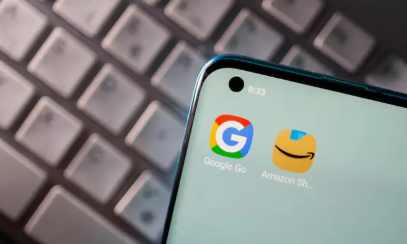 Smartphone with Google and Amazon apps are seen placed on keyboard in this illustration picture taken on June 25, 2021. &mdash; Reuters/File