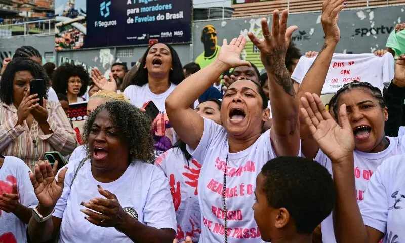 Activists and residents take part in a protest at the Penha Complex in Rio de Janeiro, Brazil, Oct 31. — AFP Activists and residents take part in a protest at the Penha Complex in Rio de Janeiro, Brazil, Oct 31. — AFP