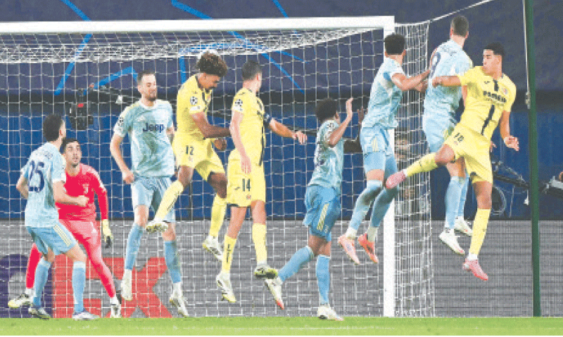 VILA-REAL: Villarreal’s Renato Veiga (fourth L) scores the equaliser against Juventus during their Champions League match at the La Ceramica Stadium.—AFP VILA-REAL: Villarreal’s Renato Veiga (fourth L) scores the equaliser against Juventus during their Champions League match at the La Ceramica Stadium.—AFP