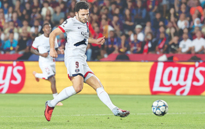 BARCELONA: Paris St-Germain’s Goncalo Ramos shoots to score the winner against Barcelona during their Champions League match at Estadi Olimpic Lluis Companys.—AFP