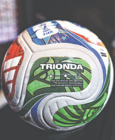    TUBIZE (Belgium): Trionda, the official ball of the 2026 FIFA World Cup, is displayed at the Proximus Basecamp.&mdash;AFP   