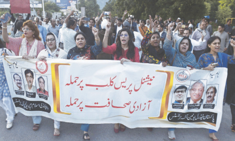JOURNALISTS march during a protest against police highhandedness at the National Press Club.&mdash;Mohammad Asim