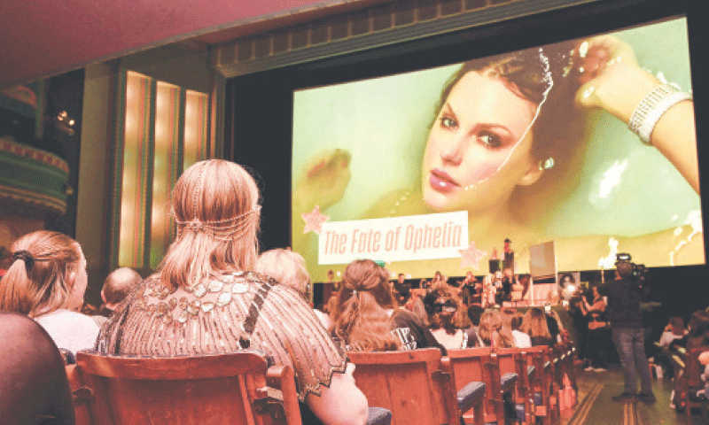 TAYLOR Swift fans listen to a song during an event at Melbourne&rsquo;s Astor Theatre.&mdash;AFP