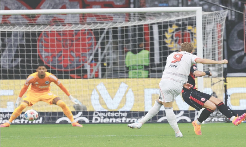 FRANKFURT: Bayern Munich’s Harry Kane scores during the Bundesliga match against Eintracht Frankfurt at Deutsche Bank Park.—AFP FRANKFURT: Bayern Munich’s Harry Kane scores during the Bundesliga match against Eintracht Frankfurt at Deutsche Bank Park.—AFP