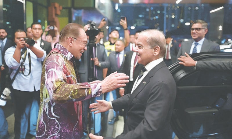 MALAYSIAN Prime Minister Anwar Ibrahim welcomes Prime Minister Shehbaz Sharif upon his arrival in Kuala Lumpur.&mdash;White Star