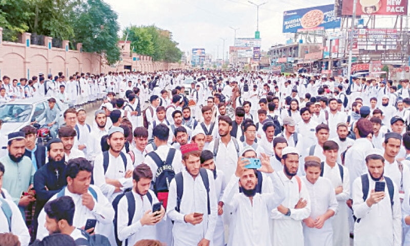 Students stage a protest in Mardan on Monday. &mdash; Dawn