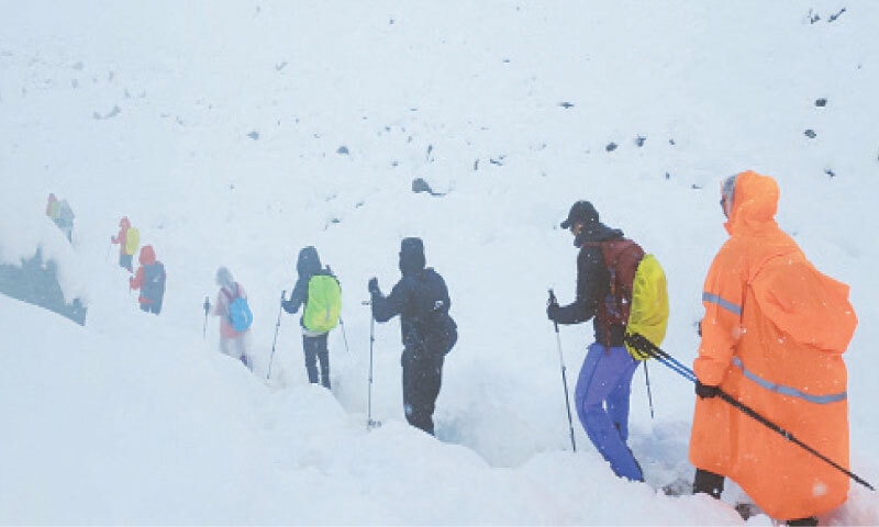 Trekkers leave their campsite as unusually heavy snow and rainfall pummelled the Himalayas.&mdash;Reuters