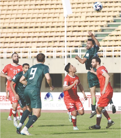 PAKISTAN’S Kaleemullah (second R) heads the ball during the 2027 AFC Cup qualifier against Afghanistan at the Jinnah Stadium on Thursday.—Tanveer Shahzad/White Star