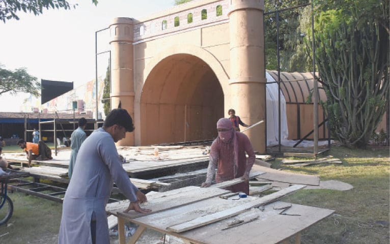 Workers prepare Balochistan Pavilion for the festival being held at Lok Versa in Islamabad from Friday (today). — Online