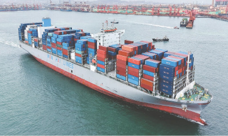 A CONTAINER ship sails at the port in Qingdao, China. — AFP A CONTAINER ship sails at the port in Qingdao, China. — AFP