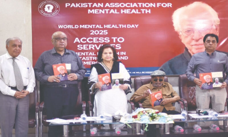 Participants display the two books launched on the occasion.
&mdash;Shakil Adil/ White Star