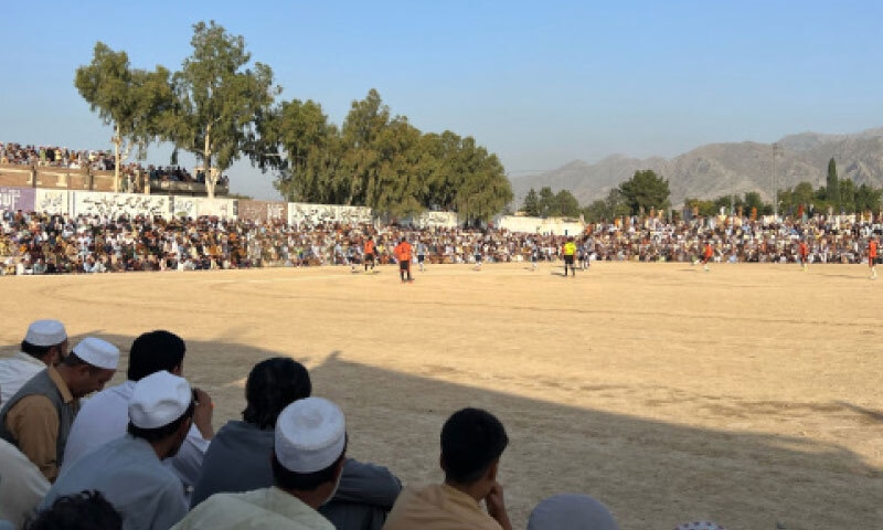 A capacity crowd watches a fiercely contested match at Landi Kotal football ground during the annual tournament. — Dawn A capacity crowd watches a fiercely contested match at Landi Kotal football ground during the annual tournament. — Dawn