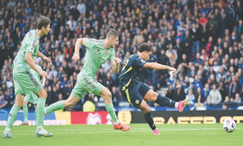 GLASGOW: Scotland&rsquo;s Che Adams shoots to score during the World Cup qualifier against Belarus at the Hampden Park Stadium.&mdash;AFP