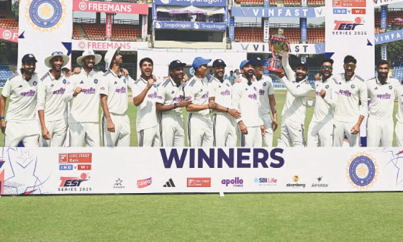 INDIAN players celebrate with the Test series trophy after defeating West Indies in the second at the Arun Jaitley Stadium on Tuesday.—AFP INDIAN players celebrate with the Test series trophy after defeating West Indies in the second at the Arun Jaitley Stadium on Tuesday.—AFP