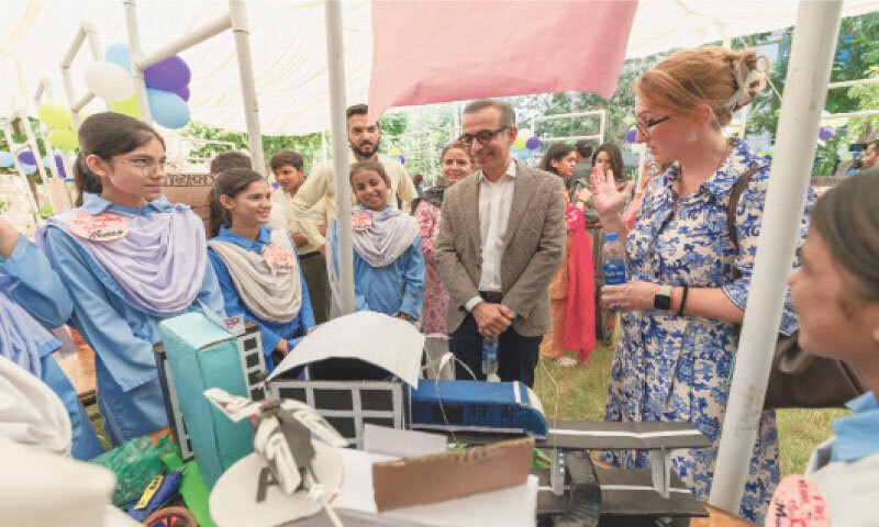 Schoolchildren display their creations at the show.&mdash;Dawn