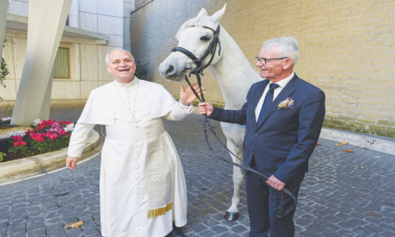 POPE Leo stands with a purebred Arabian horse given to him as a gift.&mdash;Reuters
