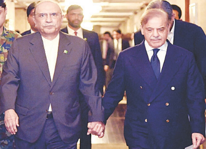 President Asif Ali Zardari walks hand-in-hand with PM Shehbaz Sharif at Aiwan-i-Sadr.&mdash;White Star
