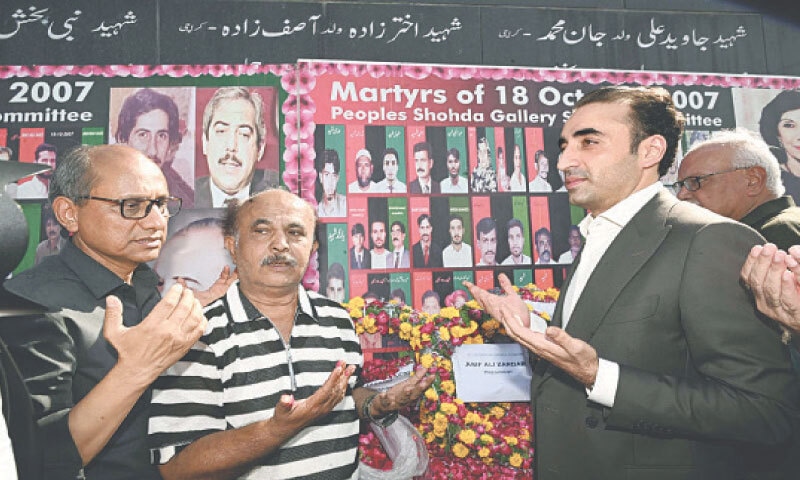 PPP Chairman Bilawal Bhutto-Zardari prays, alongside others, at the Karsaz monument on Saturday.—PPI PPP Chairman Bilawal Bhutto-Zardari prays, alongside others, at the Karsaz monument on Saturday.—PPI