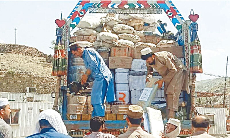 Custom officials inspect smuggled goods seized during an operation at the Torkham border at Landi Kotal in 2024: Pakistan could never see the emergence of any serious MNC in the wholesale and retail space, largely because of the inability of MNCs to maintain multiple books of accounts to manage smuggling or goods trading in the informal economy | Pakistan Press International