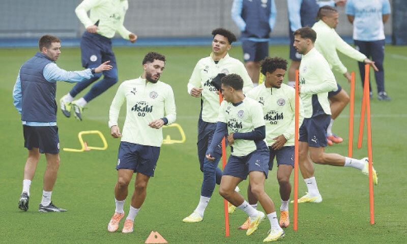 MANCHESTER: Players of Manchester City undergo drills during a training session at Etihad Campus on Monday.&mdash;Reuters