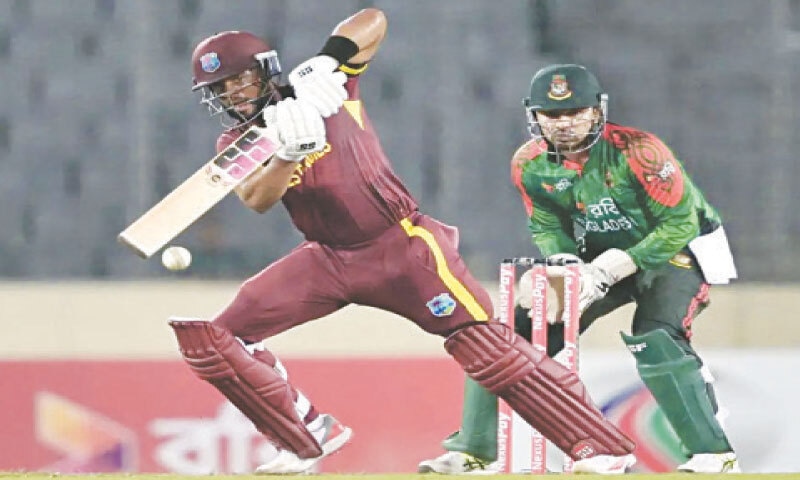 WEST INDIES captain Shai Hope plays a shot as Bangladesh wicket-keeper Nurul Hasan looks on during the second ODI at the Shere Bangla National Stadium on Tuesday.&mdash;AFP