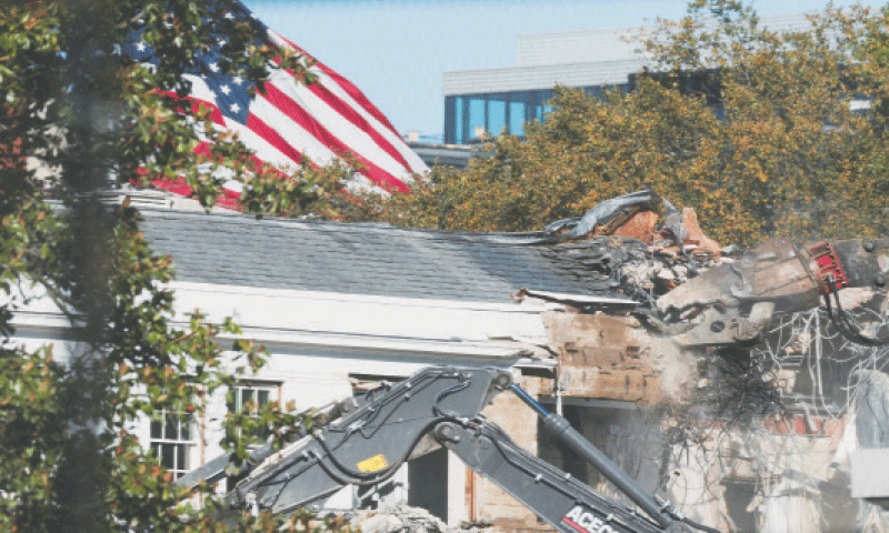 A DEMOLITION crew takes apart the facade of the East Wing of the White House.&mdash;Reuters
