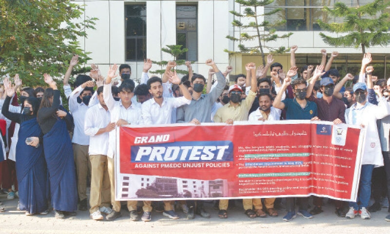 Medical students stage a protest outside PMDC in Islamabad on Wednesday. &mdash; White Star