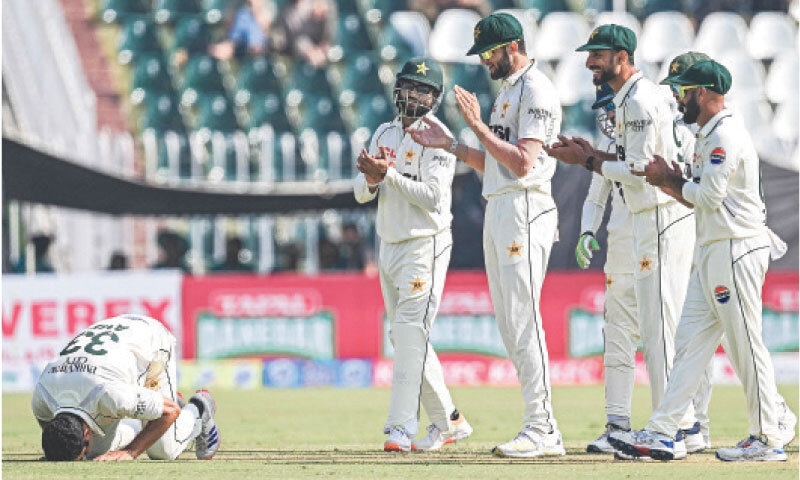 RAWALPINDI: Pakistan&rsquo;s debutant spinner Asif Afridi (left) prostrates after completing a five-wicket haul during South Africa&rsquo;s first innings in the second Test at the Pindi Cricket Stadium on Wednesday. Asif, at 38 years and 301 days, overtook England&rsquo;s Charles Marriott as the oldest debutant to take five wickets. The left-armer finished with 6-79 as Pakistan bowled out South Africa for 404 and the tourists ended the day on top with the hosts precariously placed at 94-4 in their second innings, a lead of just 23 runs with two days remaining.&mdash;AFP