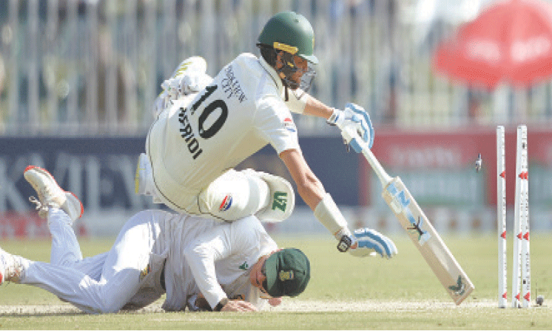 RAWALPINDI: Pakistan tailender Shaheen Shah Afridi falls onto South Africa&rsquo;s Ryan Rickleton as he is run out during the second Test at the Rawalpindi Cricket Stadium on Thursday.&mdash;Tanveer Shahzad/White Star