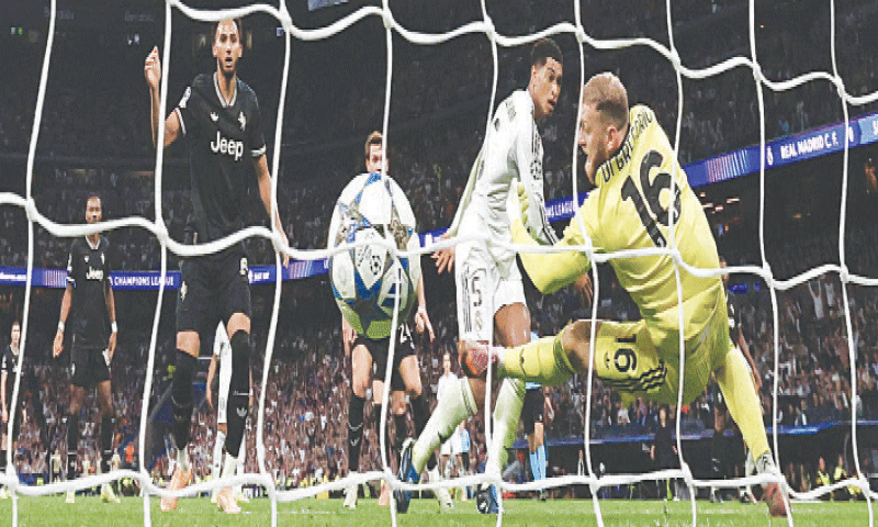 MADRID: Real Madrid’s Jude Bellingham (second R) scores past Juventus goalkeeper Michele Di Gregorio during their Champions League match at Santiago Bernabeu.—Reuters MADRID: Real Madrid’s Jude Bellingham (second R) scores past Juventus goalkeeper Michele Di Gregorio during their Champions League match at Santiago Bernabeu.—Reuters