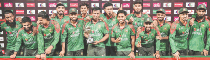 BANGLADESH players celebrate with the series trophy after their victory against West Indies in the third One-day International at the Sher-e-Bangla National Cricket Stadium on Thursday.&mdash;AFP