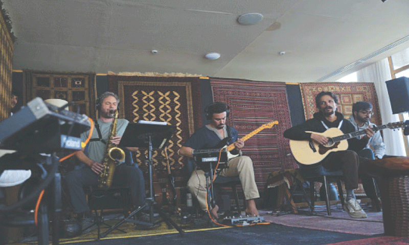 Team Humnava perform during the inaugural season of Humnava music and art camp in Aliabad in Hunza. &mdash; Dawn