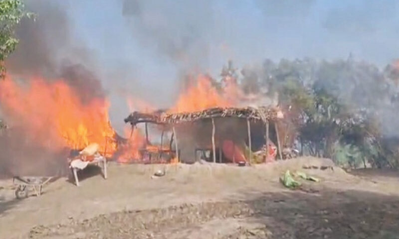 ONE of the many huts, described by police as dacoits’ hideouts, is in flame during the ongoing operation in the Andal Sundrani riverine area on Saturday.—Dawn ONE of the many huts, described by police as dacoits’ hideouts, is in flame during the ongoing operation in the Andal Sundrani riverine area on Saturday.—Dawn
