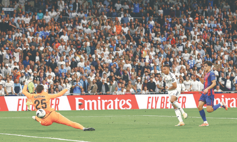 MADRID: Barcelona goalkeeper Wojciech Szczesny fails to save a shot by Real Madrid&rsquo;s Kylian Mbappe (C) during their La Liga match at Sanitago Bernabeu on Sunday.&mdash;Reuters