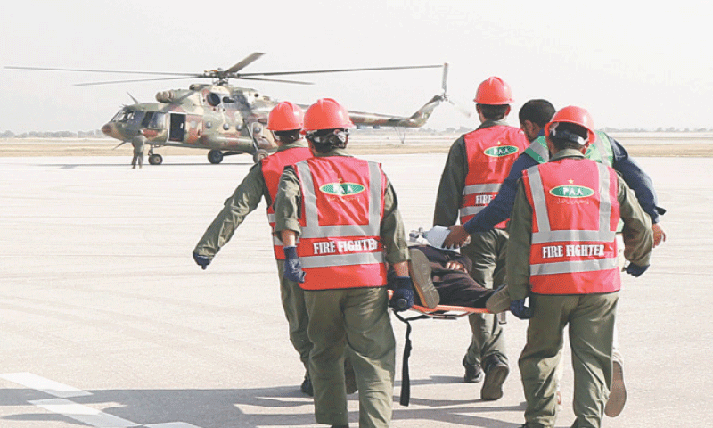 Pakistan Army Aviation&rsquo;s MI-17 helicopter conducts an aeromedical evacuation of a critically injured dummy patient to a healthcare facility during an emergency exercise at the Islamabad International Airport on Thursday. &mdash; Dawn