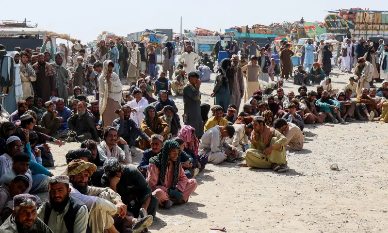Afghan citizens wait to register as they attempt to return to their country, with trucks loaded with their belongings seen in the background, after Pakistan closed border crossings for trade with Afghanistan following exchanges of fire between the two nations&rsquo; forces, at the Chaman border crossing in Balochistan on October 18, 2025. &mdash; Reuters