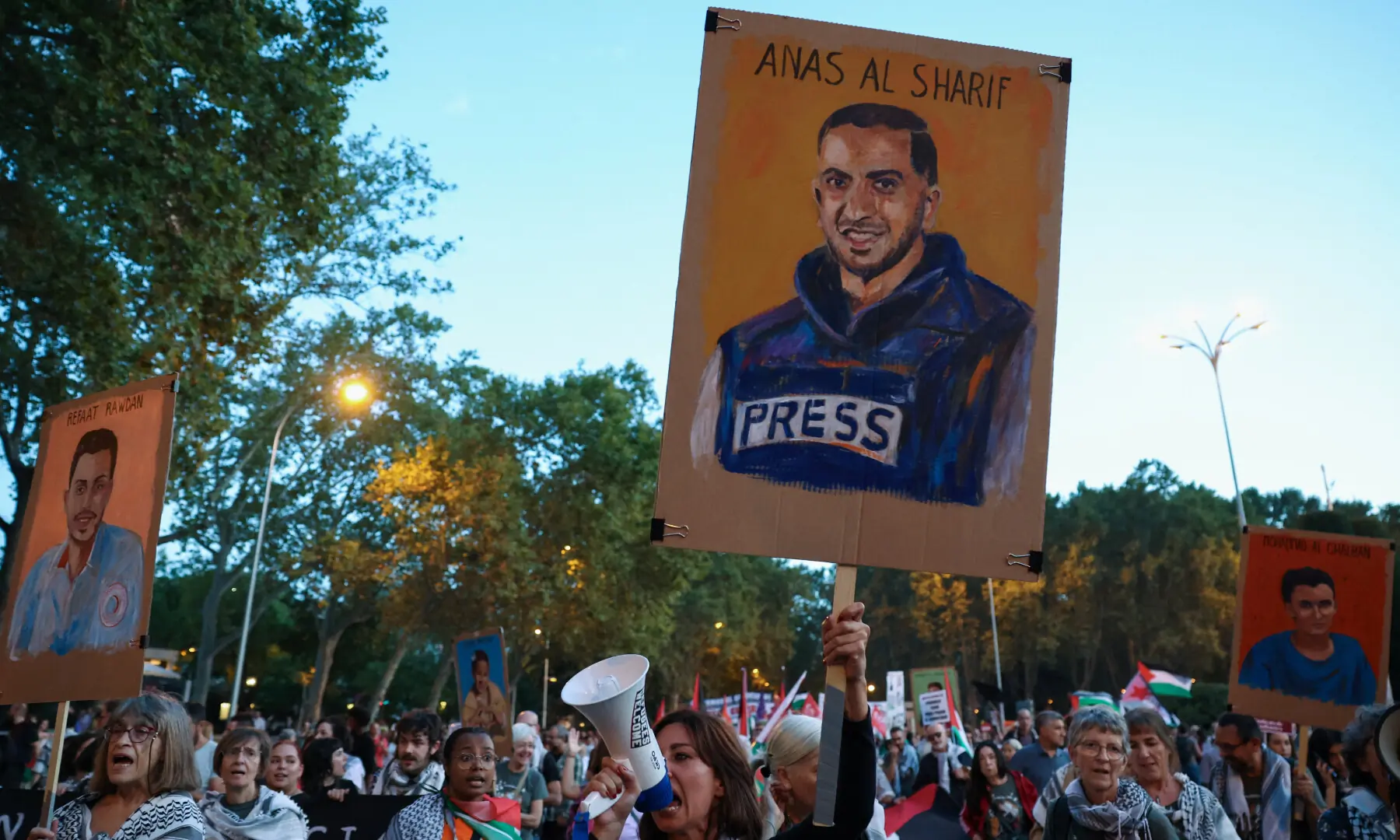 A woman displays a memorial sign of slain Palestinian Al Jazeera journalist Anas al-Sharif as people demonstrate during a general strike called by Spanish unions in solidarity with Palestinians in Gaza, in Madrid, Spain on October 15, 2025. — Reuters