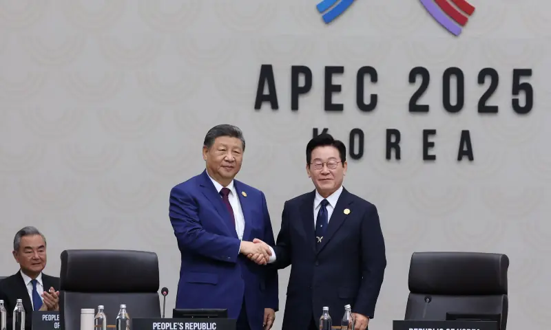 This handout photo from Apec 2025 Korea taken and released via Yonhap on Nov 1, 2025 shows South Korea&rsquo;s President Lee Jae Myung (R) shaking hands with China&rsquo;s President Xi Jinping at the handover ceremony during the Asia-Pacific Economic Cooperation (Apec) Summit in Gyeongju. &mdash; via AFP