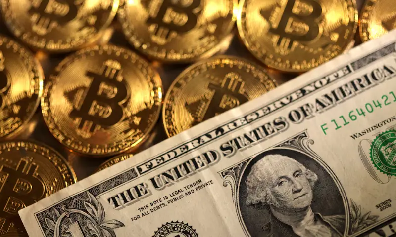 Representations of cryptocurrency Bitcoin and US dollar are seen in this illustration, August 10, 2022. &mdash; Reuters/File