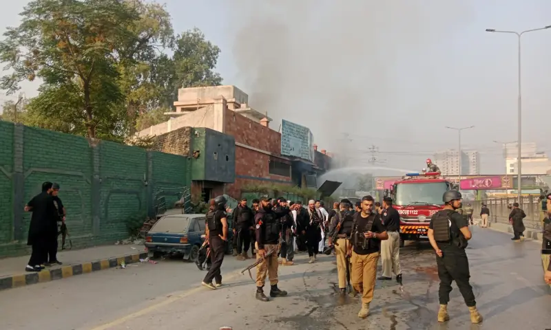 Police and rescue personnel gather outside a CTD police station in Peshawar where an explosion occurred on Nov 2, 2025. &mdash; Peshawar police