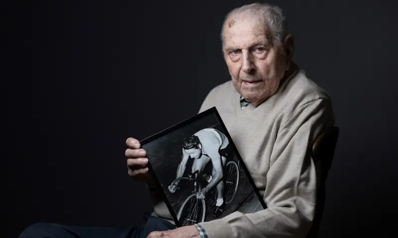 Olympic champion in Men’s Team Pursuit in track cycling at the 1948 London Games, Charles Coste, poses with a photo of himself when he was competing during a photo session at home in Bois-Colombes, northwestern of Paris, on January 30, 2024. — AFP/File