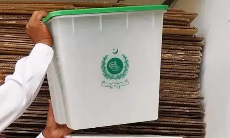 A worker sorting ballot boxes at the office of Election Commission of Pakistan. &mdash; Online/File