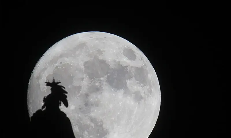 A supermoon rises over the Statue of Freedom on the Capitol dome in Washington, DC November 13, 2016. &mdash; AFP/File