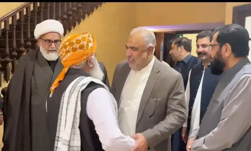 PTI leader Asad Qaiser meets Jamiat Ulema-i-Islam-Fazl chief Maulana Fazlur Rehman late on Wednesday. — Screenshot courtesy JUI-F/X PTI leader Asad Qaiser meets Jamiat Ulema-i-Islam-Fazl chief Maulana Fazlur Rehman late on Wednesday. — Screenshot courtesy JUI-F/X