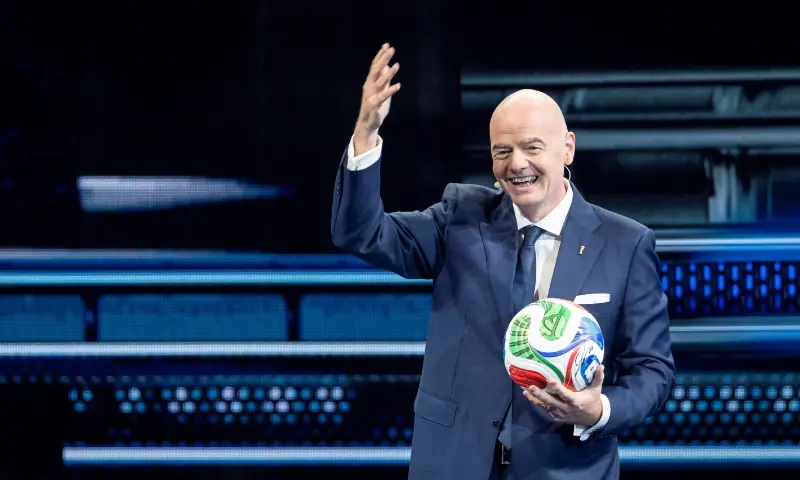 FIFA President Gianni Infantino takes the stage holding the Trionda, the official ball for the 2026 FIFA World Cup, during the America Business Forum at Kaseya Center in Miami, Florida, US on November 5, 2025. &mdash; Reuters