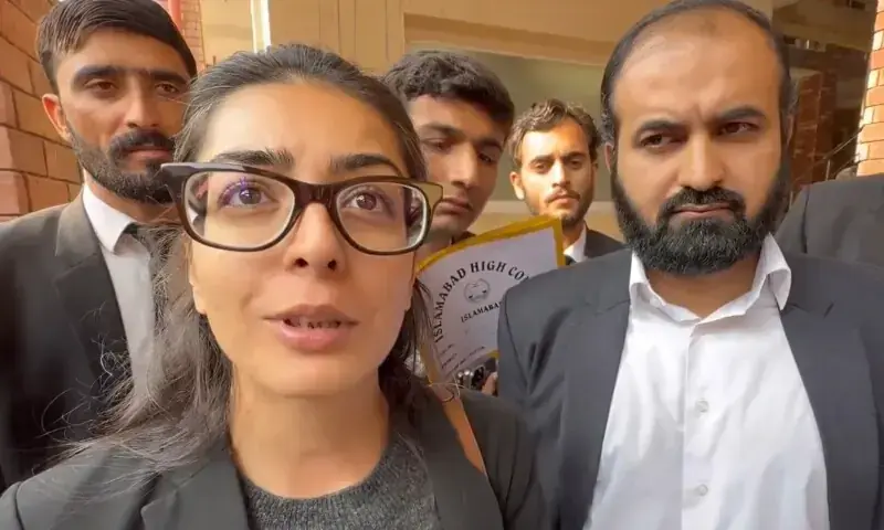 Human rights activist and lawyer Imaan Zainab Mazari-Hazir (left) and her husband, Advocate Hadi Ali Chattha (right), outside a court in Islamabad on Wednesday. &mdash; screengrab
