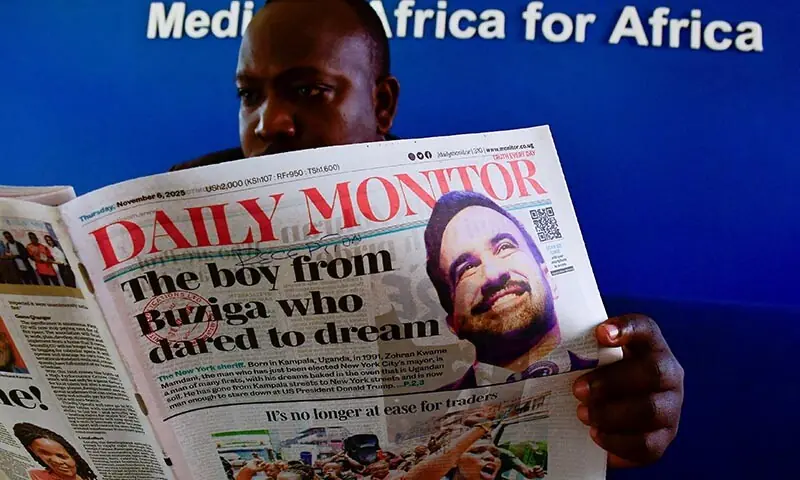 A man reads a copy of The Daily Monitor newspaper with a headline about the new Mayor of New York City Zohran Mamdani, in Kampala, Uganda on November 6. &mdash; Reuters