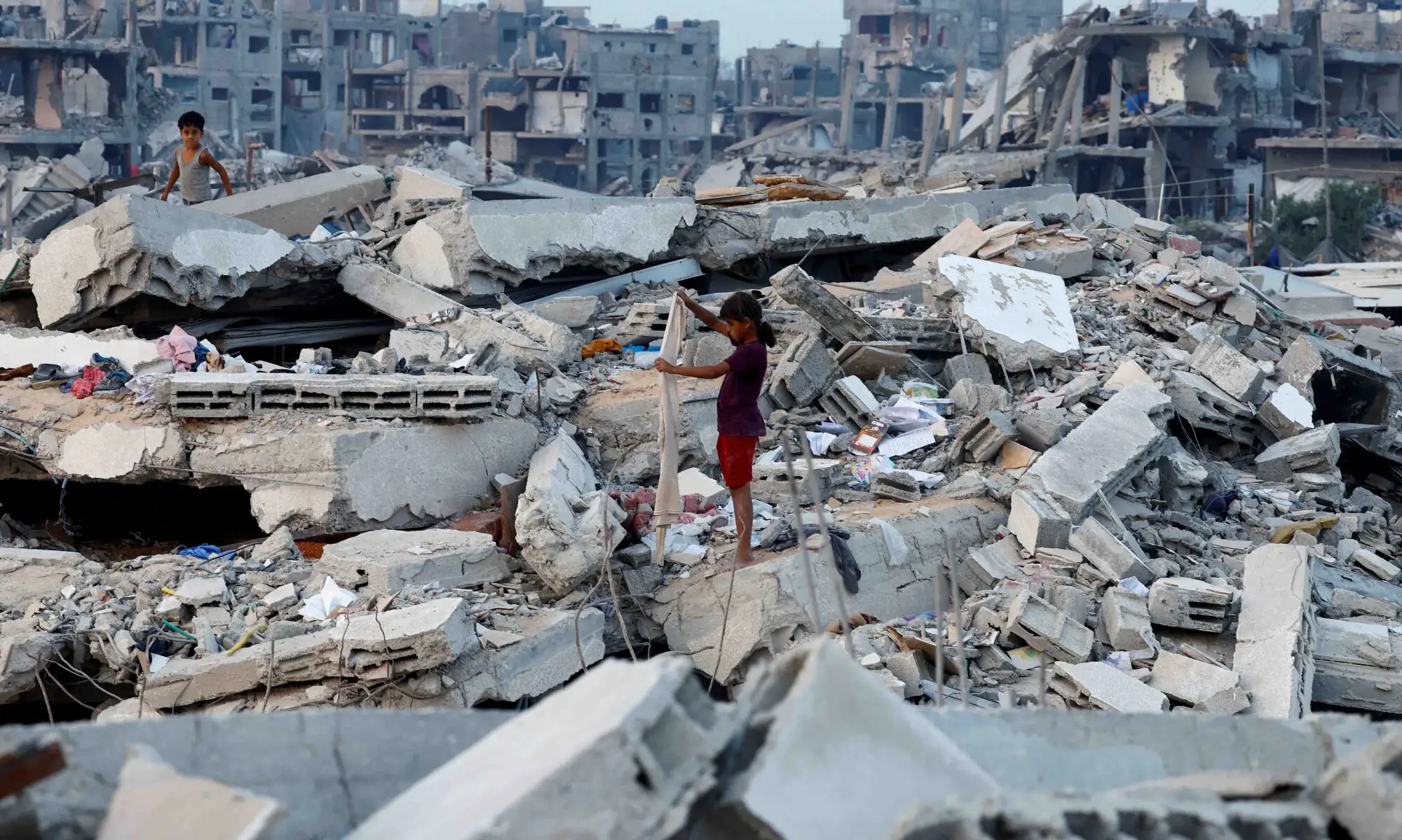 Palestinian children stand on the rubble of destroyed buildings, amid a ceasefire between Israel and Hamas, in Jabalia, northern Gaza Strip, November 6, 2025. &mdash; Reuters